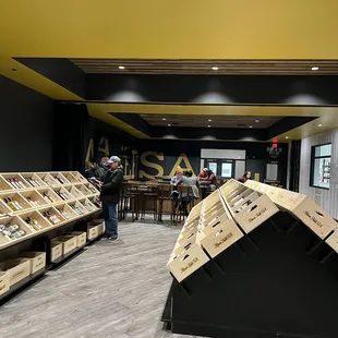 Back half of retail shop (class/tasting space beyond the shelves).