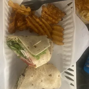 The club wrap and a wrap with chicken, hummus, and veggies. Sides: Mac and cheese and fries