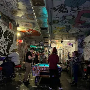 people playing a game in a bar