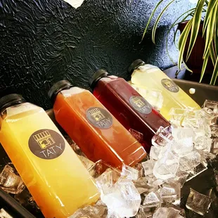 a variety of juices on ice