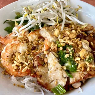 a plate of food with noodles and shrimp