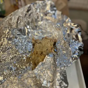 a sandwich wrapped in foil