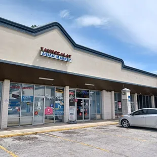 a car parked in front of the store