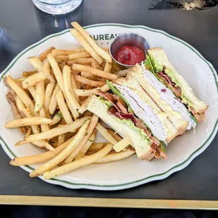 a club sandwich and french fries