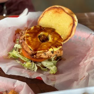 Hawaiian chicken sandwich with lettuce, pineapple, and tomato