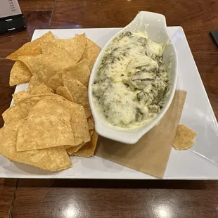 Best spinach artichoke dip with homemade seasoned chips. Definitely a must try!!