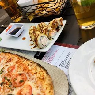 a pizza and beer on a table