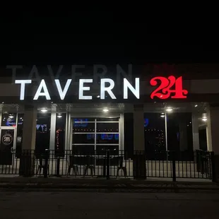 the front of the restaurant at night