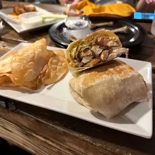 Blackened Chicken Sandwich in a wrap with chips