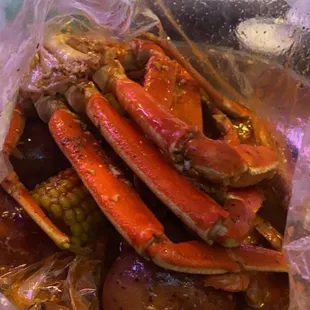 Seafood combo two crab clusters, 10 shrimp and corn and potatoes for 41.95 Spicy juicy seasoning