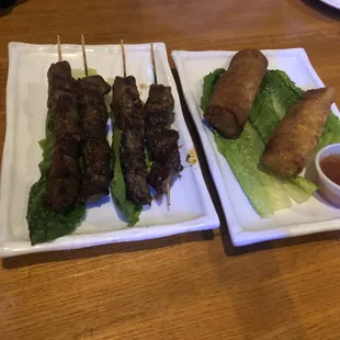 Teriyaki skewers and egg rolls