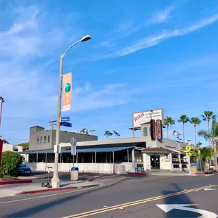 a street corner with palm trees