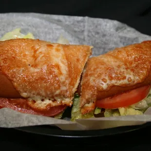 Our Italian sub is a combination of salami, ham, pepperoni, Banana Peppers and Grande Cheese with our special dressing.  YUMMY!