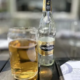 a glass of beer and a bottle