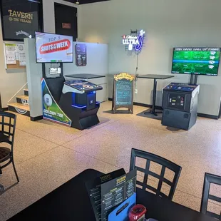 Gaming area. Golden Tee, darts, bowling, putt putt and lawn darts.