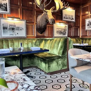 Love the velvet booths and beautiful wood