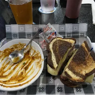 Finished bowl of chili and pastrami sandwich