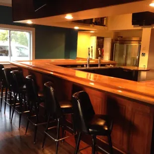 a bar with chairs