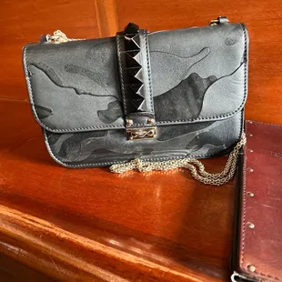 a purse and a wallet on a table