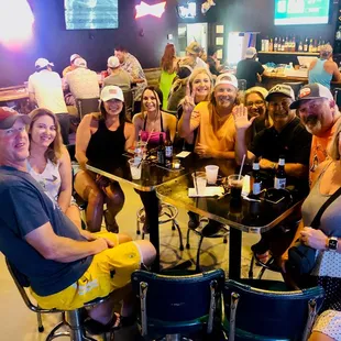 a group of people sitting at a table