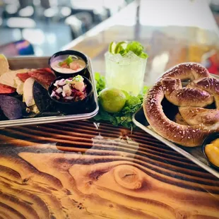 a pretzel, a beer, and a salad