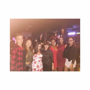 a group of women posing for a picture