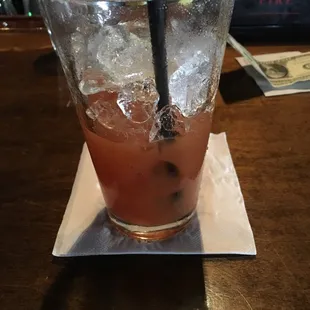 a bloody drink with ice and lime