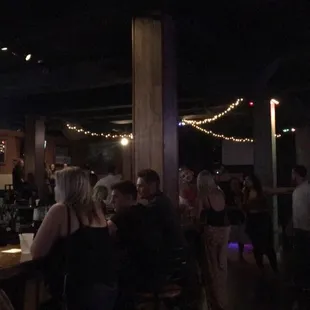 a crowd of people at a bar