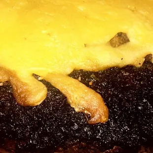 Extra charred Burnt Burger, hard as a rock.