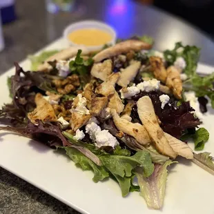 Tavern Salad - spring mix (not just iceberg!!), goat cheese, walnuts, craisins, and chicken with a honey mustard vinaigrette dressing.