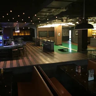 Corn hole area next to one of the bars.