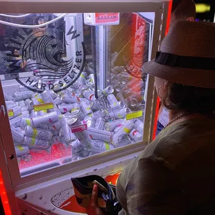 a man looking through a vending machine