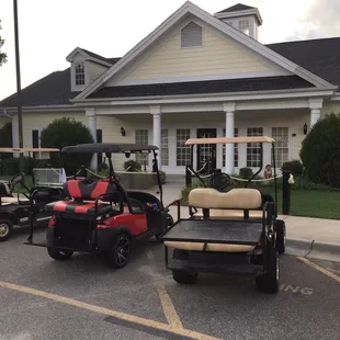 several golf carts parked in a parking lot