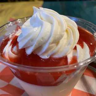 a dessert with whipped cream on top