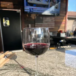 This is photo of a glass of house Merlot for 4.00. It's pretty good.