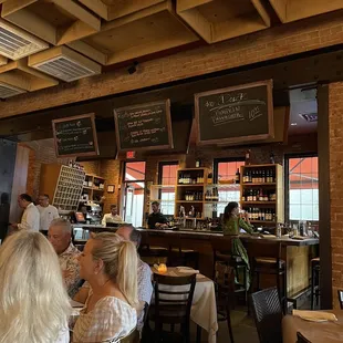 people sitting at tables in a restaurant