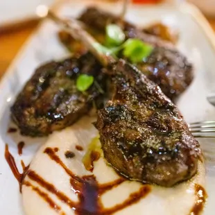 ARNAKI three grilled Superior Farms lamb chops / patates / young onions / lamb jus