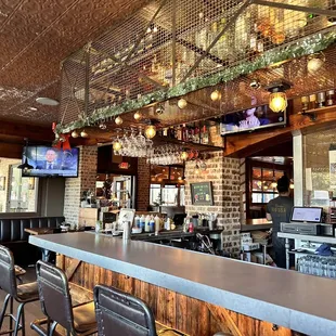 a bar with a large screen tv