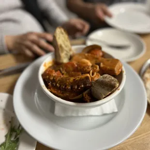 a bowl of soup and a slice of bread