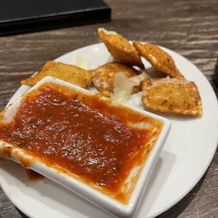 Fried ravioli with a delicious creamy melty cheese inside