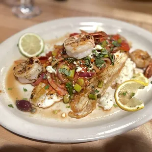 Sea bass and shrimp over risotto.