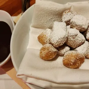 HH Lemon Zeppole w/powdered sugar, served warm with chocolate sauce ($8, 1/22/24)