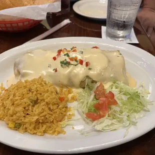 Fajita chicken burrito topped w queso