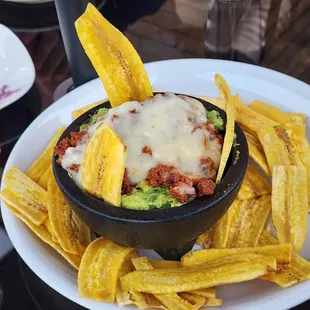 Guacamole Cali topped with cheese and chorizo!