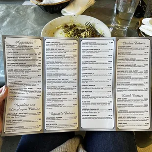 a person holding a menu
