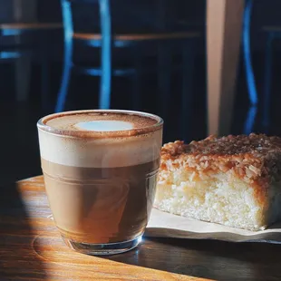 a piece of cake and a glass of coffee