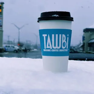 a coffee cup in the snow