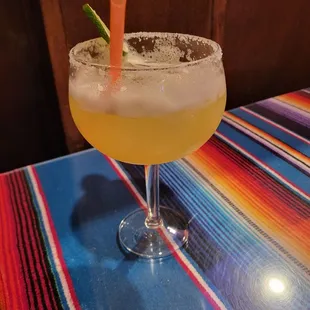 a margarita with a carrot garnish
