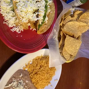 Stale hard shell tacos and cold rice and beans.