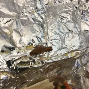 I went to get a fish taco for lunch and this was in my food. I am disgusted and so disappointed in this restaurant.